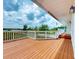 Inviting outdoor deck with ample space, white railing, and a covered area for year-round enjoyment at 2950 Sunset Dr, New Smyrna Beach, FL 32168