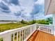 Relaxing deck with panoramic views of the tranquil waterfront and lush green landscape, perfect for outdoor living at 2950 Sunset Dr, New Smyrna Beach, FL 32168