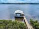 Picturesque boat dock with a covered area, perfect for relaxing by the water at 2950 Sunset Dr, New Smyrna Beach, FL 32168