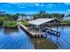 Charming waterfront property featuring a private boat dock and scenic views at 2950 Sunset Dr, New Smyrna Beach, FL 32168