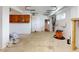 Garage with tan cabinets, tan doors and concrete floor at 2950 Sunset Dr, New Smyrna Beach, FL 32168