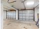 Garage featuring two roll up doors and concrete floor at 2950 Sunset Dr, New Smyrna Beach, FL 32168