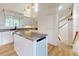 Beautiful kitchen featuring granite countertops, stainless steel appliances, and a center island with seating at 2950 Sunset Dr, New Smyrna Beach, FL 32168