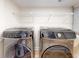 Laundry room featuring a Samsung washer and dryer with a white shelf above at 2950 Sunset Dr, New Smyrna Beach, FL 32168