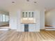 Stylish living room with built-in bar area and hardwood floors, perfect for entertaining guests and relaxing at home at 2950 Sunset Dr, New Smyrna Beach, FL 32168