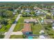 A wide shot view displays the neighborhood layout, with the property situated amongst tree lined streets at 3044 Pine Tree Dr, Edgewater, FL 32141