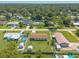An elevated neighborhood view, focusing on the property's prime location amongst trees and nearby residences at 3044 Pine Tree Dr, Edgewater, FL 32141