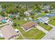 This aerial shot showcases a charming single-Gathering home with a spacious yard and inviting backyard pool area at 3044 Pine Tree Dr, Edgewater, FL 32141