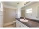 Bathroom with tiled stand-up shower and a vanity with white cabinets at 3044 Pine Tree Dr, Edgewater, FL 32141