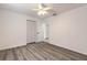 Bedroom featuring wood-look floors, closet, and neutral paint at 3044 Pine Tree Dr, Edgewater, FL 32141