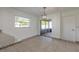 Cozy dining area featuring tiled floors, modern lighting, and sliding glass doors to a screened outdoor patio at 3044 Pine Tree Dr, Edgewater, FL 32141