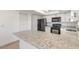Kitchen island boasts granite countertop with full appliance package at 3044 Pine Tree Dr, Edgewater, FL 32141