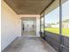 Covered patio with view of grassy yard and shed at 3044 Pine Tree Dr, Edgewater, FL 32141