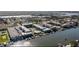 Expansive aerial view of waterfront condo buildings with docks, boat slips, and a pool at 315 N Causeway # 2060, New Smyrna Beach, FL 32169