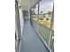 Enclosed balcony featuring views of the community pool and landscaping at 315 N Causeway # 2060, New Smyrna Beach, FL 32169