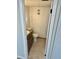 Half bathroom with neutral paint, light fixtures, and a tiled floor at 315 N Causeway # 2060, New Smyrna Beach, FL 32169