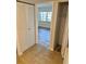 Entryway to bedroom, features tile flooring, a closet, with neutral-colored walls and trim at 315 N Causeway # 2060, New Smyrna Beach, FL 32169
