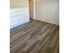 Bedroom features wood-look flooring and neutral paint at 315 N Causeway # 2060, New Smyrna Beach, FL 32169