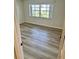 Bedroom with neutral paint and laminated floors offers a clean and bright living space at 315 N Causeway # 2060, New Smyrna Beach, FL 32169