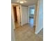 Hallway with tile flooring with entryways to the bathroom, bedroom and kitchen at 315 N Causeway # 2060, New Smyrna Beach, FL 32169