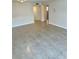 Bright living room with tile flooring, neutral walls, and ample natural light at 315 N Causeway # 2060, New Smyrna Beach, FL 32169