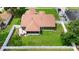 A lush green lawn and screened in porch grace this property with a fenced yard for outdoor relaxation at 3231 Bretton Woods Ter, Deltona, FL 32725