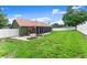 The spacious backyard features a screen enclosed lanai and a manicured lawn perfect for outdoor enjoyment at 3231 Bretton Woods Ter, Deltona, FL 32725
