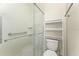 Clean bathroom featuring a glass door shower and a storage rack at 3231 Bretton Woods Ter, Deltona, FL 32725