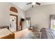 Spacious bedroom with high ceilings, a ceiling fan, and a view to the outside at 3231 Bretton Woods Ter, Deltona, FL 32725