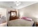 Comfortable bedroom featuring a ceiling fan and a wooden dresser with a mirror at 3231 Bretton Woods Ter, Deltona, FL 32725