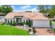 Charming one story home with a beautiful lawn, lush landscaping, and a new roof at 3231 Bretton Woods Ter, Deltona, FL 32725