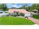 Charming one story home with a beautiful lawn, lush landscaping, and a new roof at 3231 Bretton Woods Ter, Deltona, FL 32725