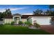 Charming single-story home featuring lush lawn and well-maintained landscaping and neutral paint at 3231 Bretton Woods Ter, Deltona, FL 32725