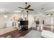 Spacious living room with hardwood floors, modern ceiling fan, and ample natural light at 3231 Bretton Woods Ter, Deltona, FL 32725
