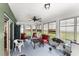 Enclosed sunroom with ample seating, ceiling fan, and lots of natural light coming through the windows at 3231 Bretton Woods Ter, Deltona, FL 32725