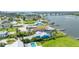 Aerial view of waterfront property, boasting a pool and private dock with waterway access at 3326 S Peninsula Dr, Port Orange, FL 32127