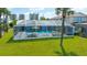 Aerial view of a screen enclosed pool, patio and yard at 3326 S Peninsula Dr, Port Orange, FL 32127