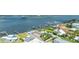 Waterfront home with boat dock and bay access, boasting ample parking and landscaping at 3326 S Peninsula Dr, Port Orange, FL 32127