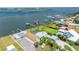 Waterfront home featuring a boat dock, bay access, landscaping, and ample parking spaces at 3326 S Peninsula Dr, Port Orange, FL 32127