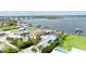 Stunning aerial view of waterfront homes, showcasing dock access and nearby bridges at 3326 S Peninsula Dr, Port Orange, FL 32127