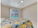Bedroom with a view of screened in pool and ceiling fan at 3326 S Peninsula Dr, Port Orange, FL 32127