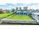 Waterfront property boasting a screened-in pool and lush backyard with city views in the distance at 3326 S Peninsula Dr, Port Orange, FL 32127