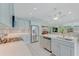 Modern kitchen with stainless appliances, recessed lighting, and seamless flow to the living areas at 3326 S Peninsula Dr, Port Orange, FL 32127