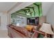 Open-concept living room boasts beamed ceilings, tile flooring, and seamless flow to the pool area at 3326 S Peninsula Dr, Port Orange, FL 32127