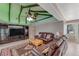 Spacious living room features stylish furniture, a ceiling fan, and neutral color palette at 3326 S Peninsula Dr, Port Orange, FL 32127