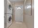 Functional mud room with stacked washer/dryer and convenient access to the home's exterior at 3326 S Peninsula Dr, Port Orange, FL 32127