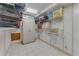 A storage room with tile floors, wire racks, and a white metal cabinet at 3326 S Peninsula Dr, Port Orange, FL 32127
