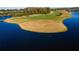Panoramic aerial view of the community showcasing golf courses, lakes, and lush greenery in the area at 3577 Maribella Dr, New Smyrna Beach, FL 32168