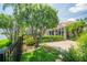 Well maintained backyard featuring mature trees and screened pool area at 3577 Maribella Dr, New Smyrna Beach, FL 32168