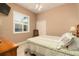 Bedroom featuring a wooden headboard bed, light green bedding, neutral walls and bright natural light at 3577 Maribella Dr, New Smyrna Beach, FL 32168